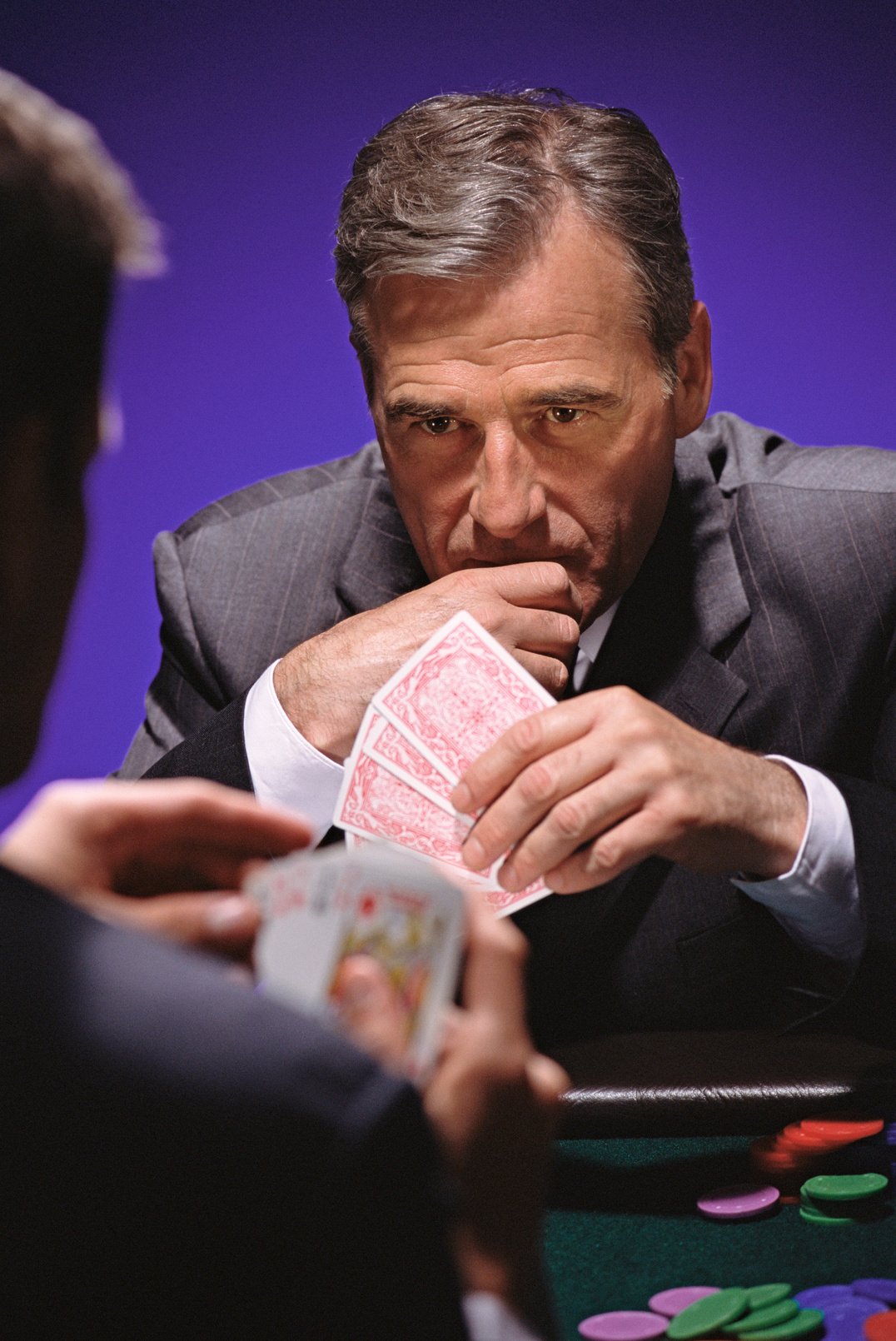 Businessman playing poker